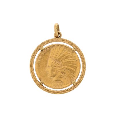 un gros plan d'une pièce d'or sur laquelle figure une tête d'Indien
