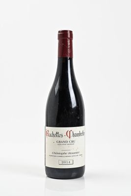 a bottle of wine that is sitting on a table