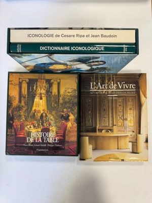 three books that are sitting on top of a table