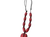 a close up of a red necklace on a white background