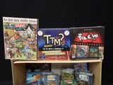 many board games on display in a cardboard box