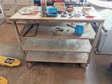 a workbench with tools on top of it in a room