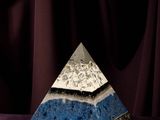 an image of a blue and white pyramid on a purple cloth