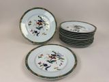 several plates with floral designs are stacked on top of each other