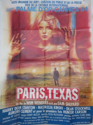 the poster for paris texas is displayed on a wall
