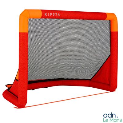 a close up of a red and orange soccer goal with a net