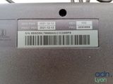 the back of a laptop computer with a bar code on it
