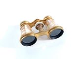 a pair of binoculars that are sitting on a white surface
