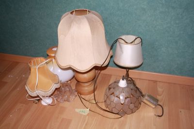 a lamp that is sitting on the floor next to a lamp