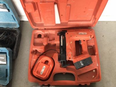 a tool in the case that is sitting on the floor