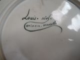 a close up of a plate with writing on it