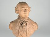 a close up of a bust of a man wearing a tie
