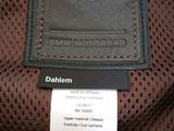 the label on the back of a brown leather jacket