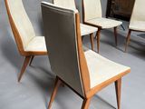 six mid century style dining chairs with leather upholstered seats
