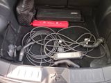a car trunk with a bunch of wires in it