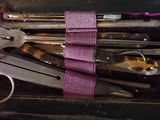 many different types of tools in a purple case