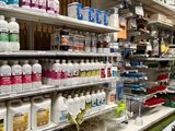 a man that is standing in front of a store shelf