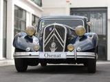 an old car that is parked on the street
