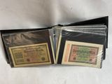 two old german bank notes are in a black wallet