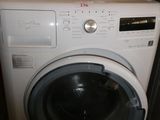 a washer and a dryer in a small room