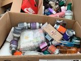 a cardboard box filled with assorted items on the street