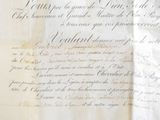 an old document with writing on it on a piece of paper