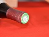 a close up of a bottle of wine on a table