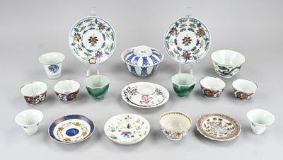 many different types of dishes and cups on the table