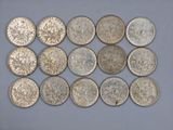 a close up of a bunch of coins sitting on top of a table