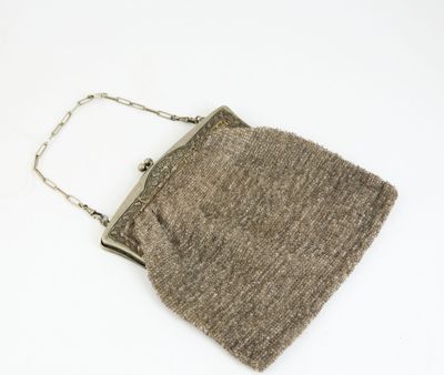 an image of a brown purse on a white surface