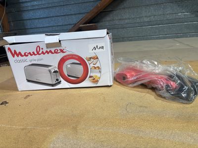 a box with a toaster on it sitting on the floor