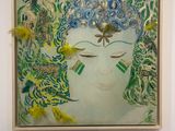 painting of a woman ' s face with feathers and feathers in her hair