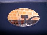 a reflection of a car in the window of a car