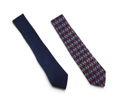 two ties on a white surface one is blue and the other is red