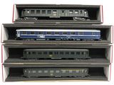 four train cars are stacked on top of each other in a box