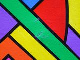 abstract painting of a multicolored geometric design on a wall