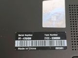 a close up of the back of a laptop with a barcode on it