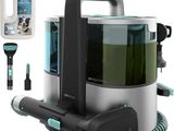 a vacuum that is sitting next to a bottle of cleaner