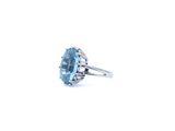 an image of a ring with a blue topazr stone in it