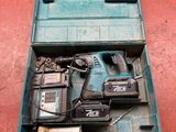 a tool box with tools in it on a red surface