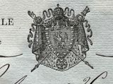 a close up of a piece of paper with a picture of a coat of arms on it