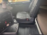 a view of the inside of a vehicle from the driver ' s seat