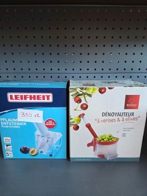 two boxes of food sitting on a shelf in a store