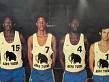 an old photo of a basketball team posing for a picture