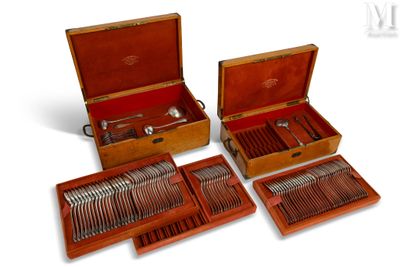 four pieces of silverware in a case on the table