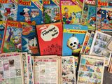 a lot of comic books on the floor