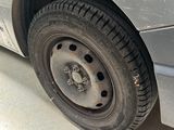 a car that has a flat tire on the side of the road