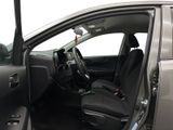 the interior of a car with the door open and the driver ' s seat down