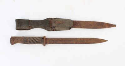 two old knives that are on a white surface