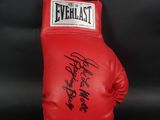 a close up of a red boxing glove on a black background